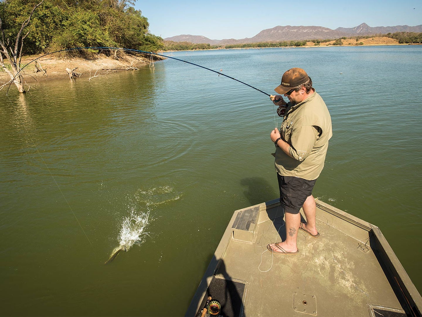 Angler fishing largemouth bass on Lake Picachos
