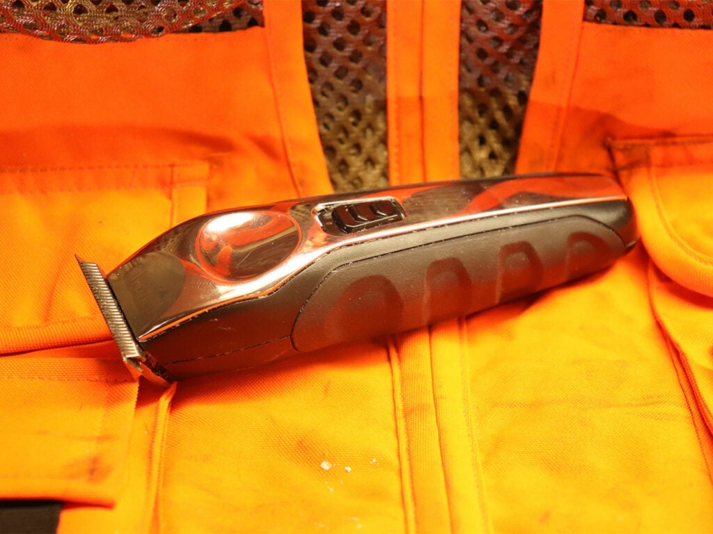 Hair clippers on a hunting vest.