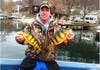 photo of angler holding up perch fish.