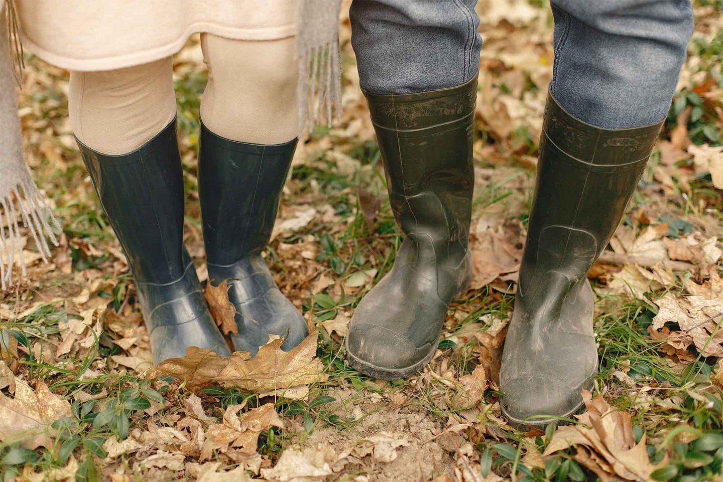 Two people wearing rubber boots