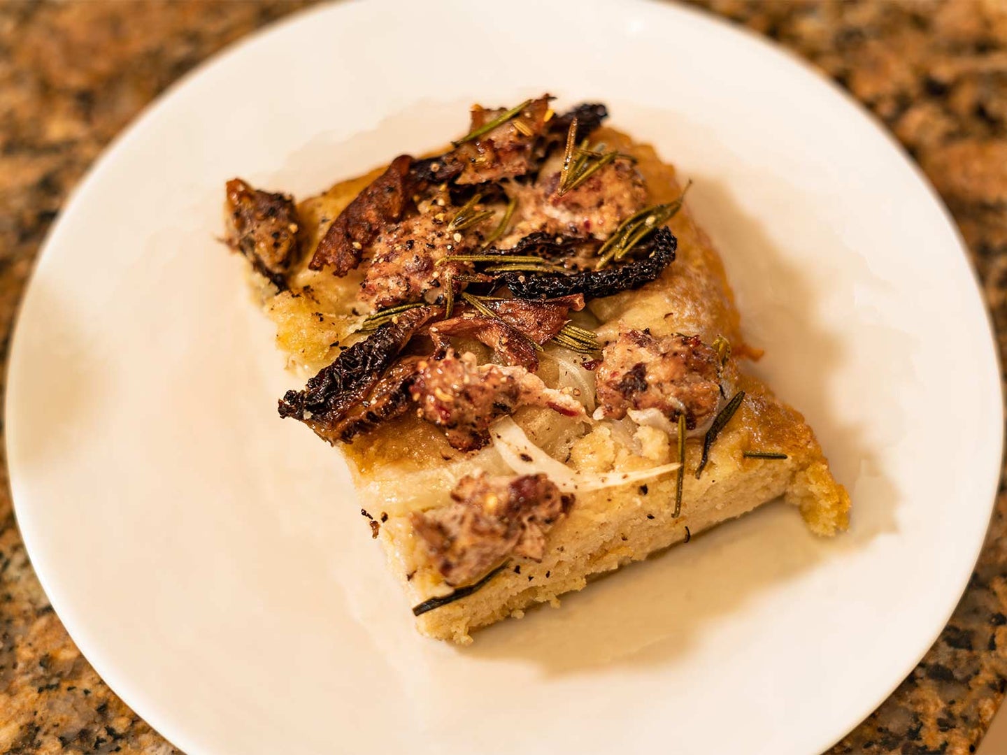 Homemade focaccia topped with morels and wild-turkey sausage.