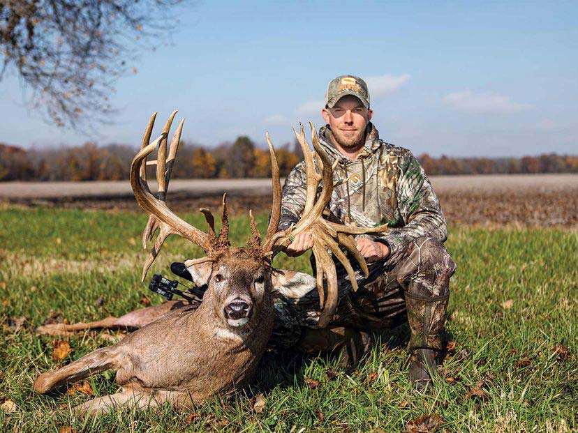 Luke Brewster with a large whitetail record buck.