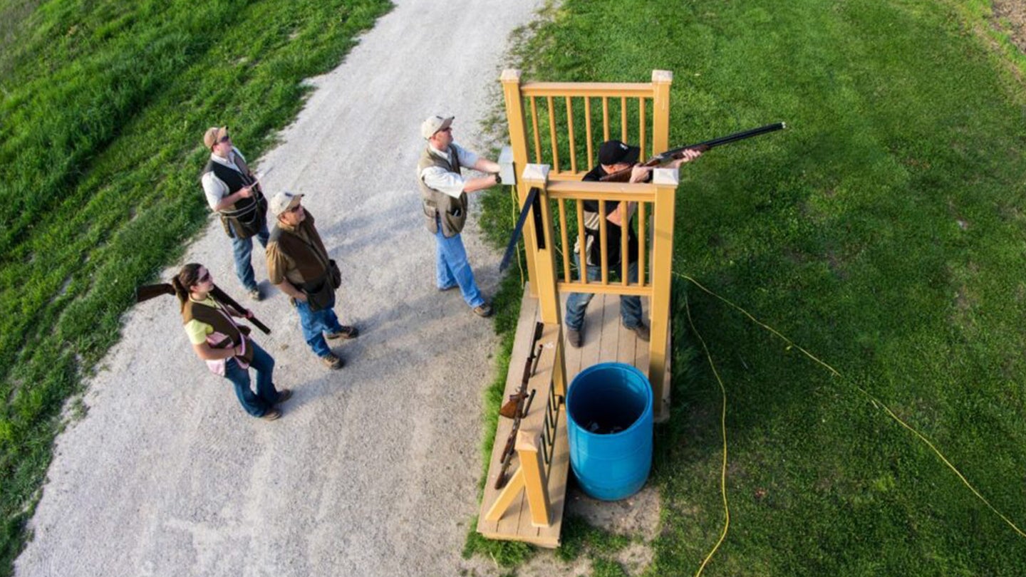 A group of shooters on a sporting clays course.