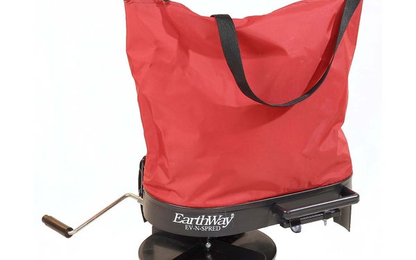 An EarthWay hand seed spreader on a white background.