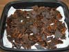 A pile of beef jerky that's been cooked in the oven.