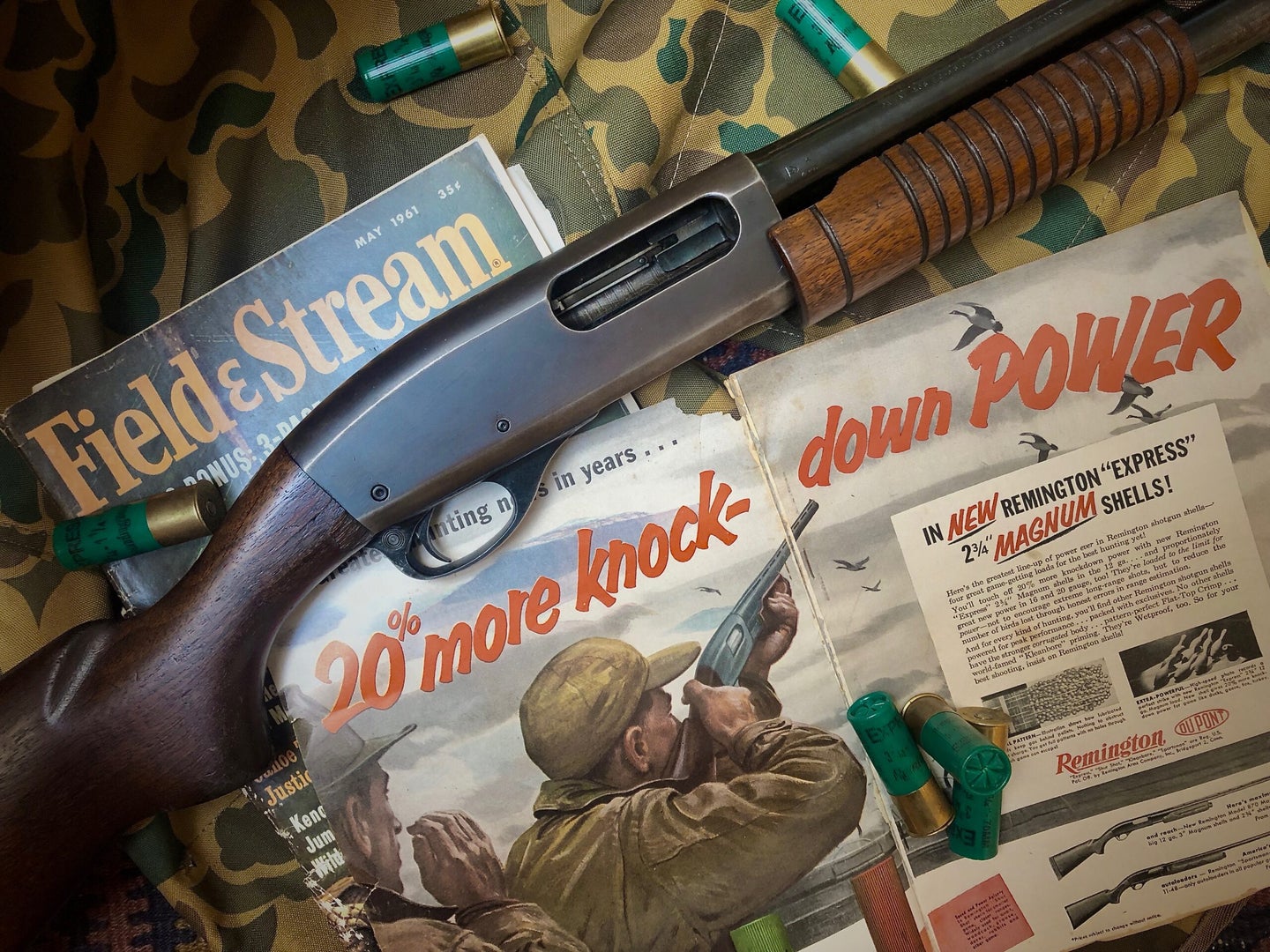 Shotgun with vintage Field & Stream magazines.
