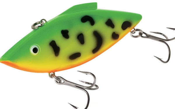 A green lure with black spots on a white background.