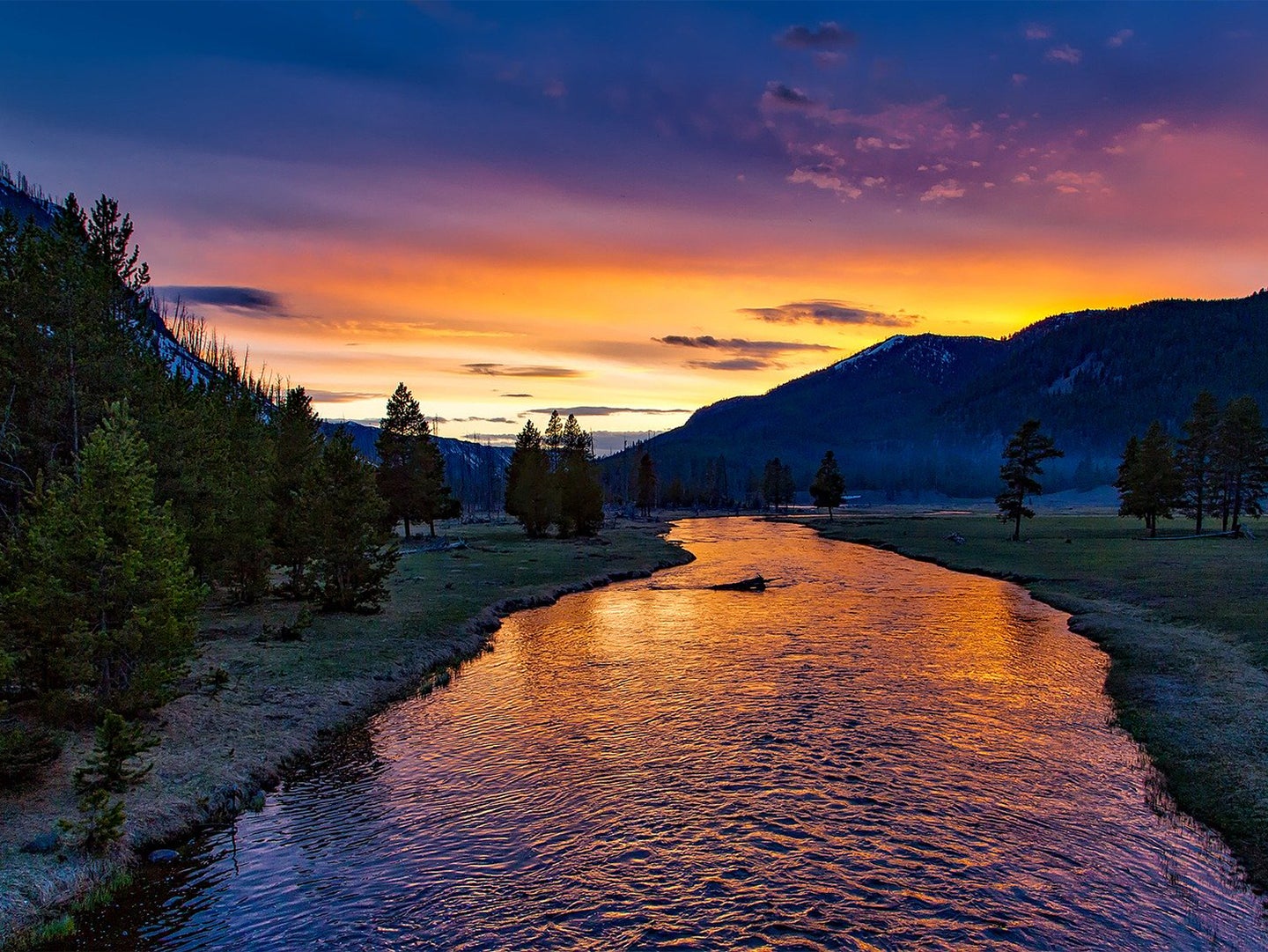 A sunset overlooking the Yellowstone River in Yellowstone National Park.