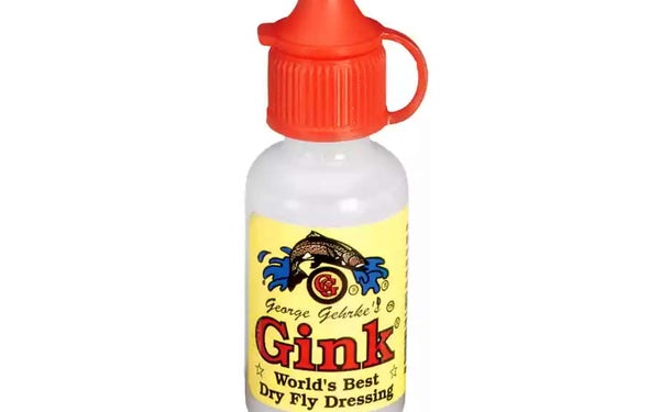 A bottle of dry fly dressing Gink on a white background.