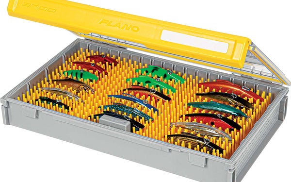 Plano Edge Tackle Boxes filled with fishing lures on a white background.