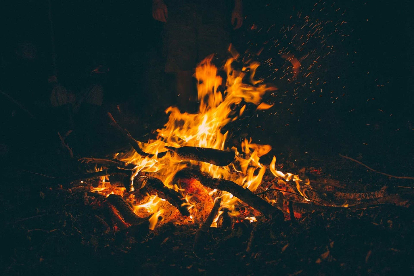 A campfire burning at night.