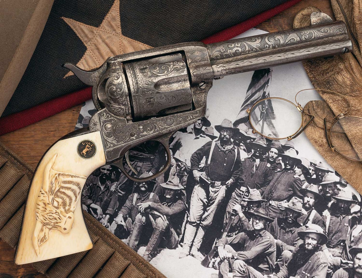 A Colt single action army revolver on an antique photo and flag.