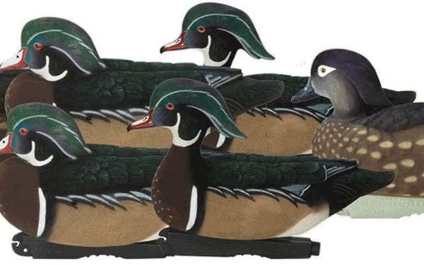 A group of duck decoys on a white background.