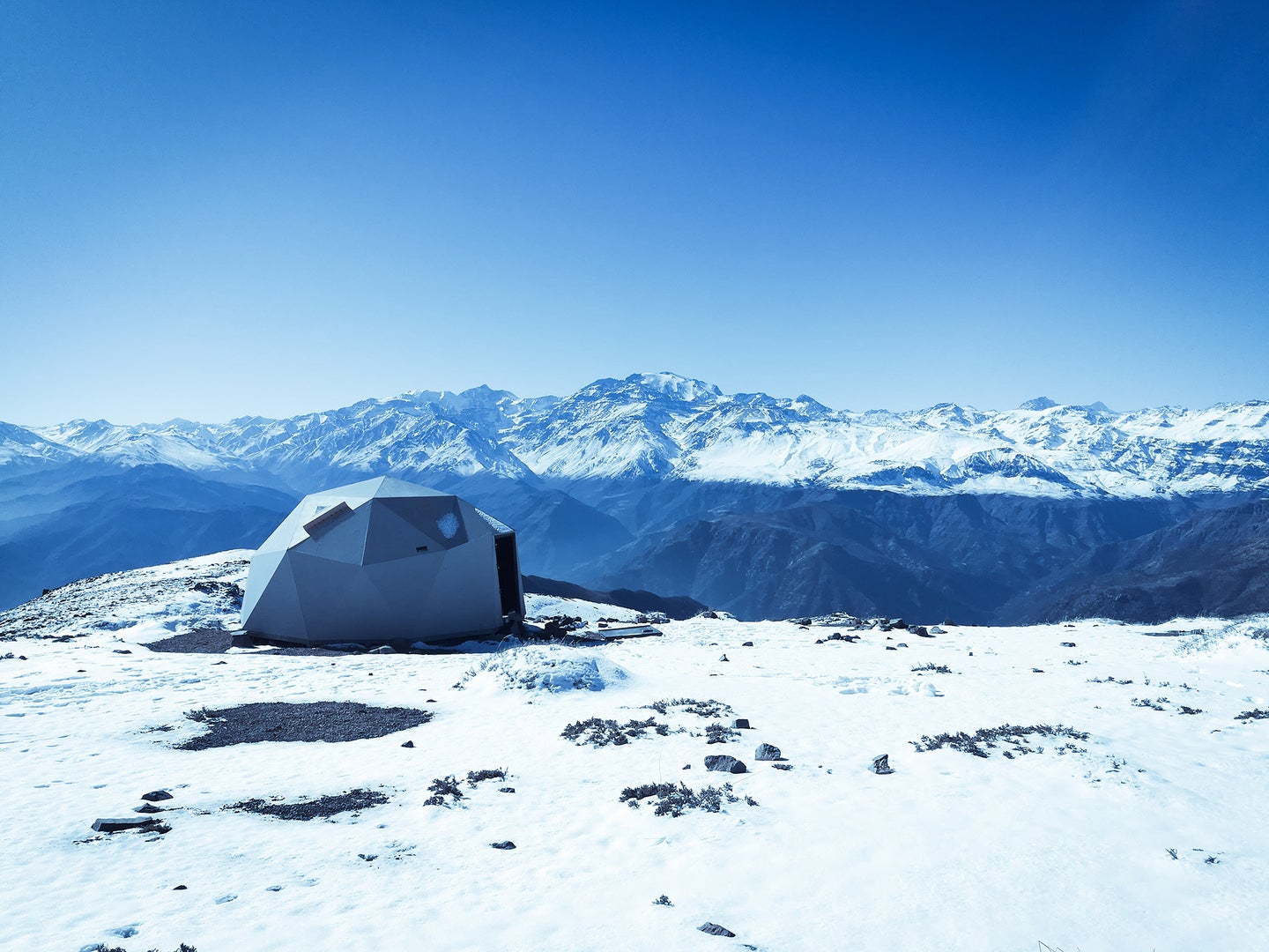 white tent on a snowy mountain