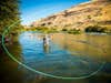 An angler fly fishes in Deschutes River, Oregon.