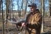 Mann with big matched 10-poin shed antlers 