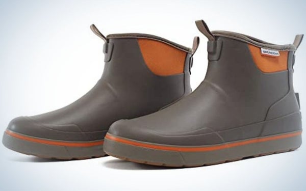 A pair of boots from the sides with two colors brown and orange.