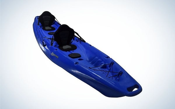 A kayak in strong blue color in the body and black on the place where you can sit captured from the side.