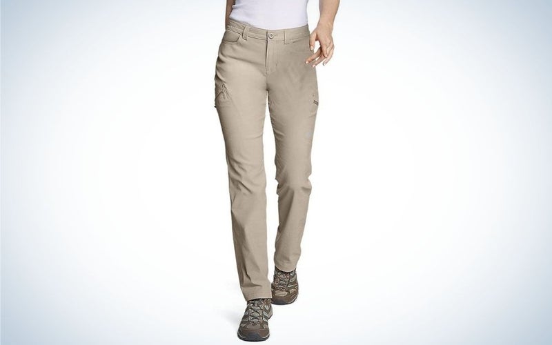 A pair of tight beige hiking pants with a pocket on the side.