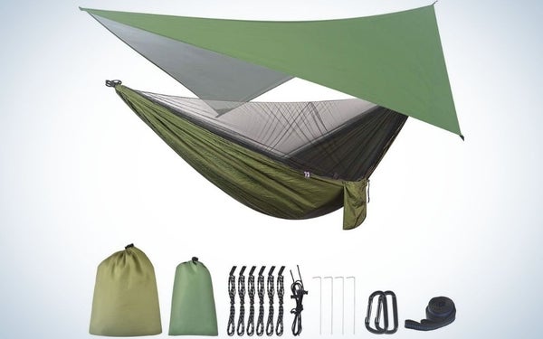 A green hammock with a cover blanket also in green color and two bags for placing the folded hammock, rope and two metal steel carabiner.