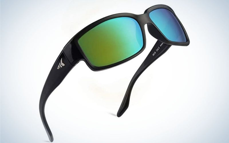 A pair of sunglasses with a black frame and structure and two lenses in bright colorful shades.