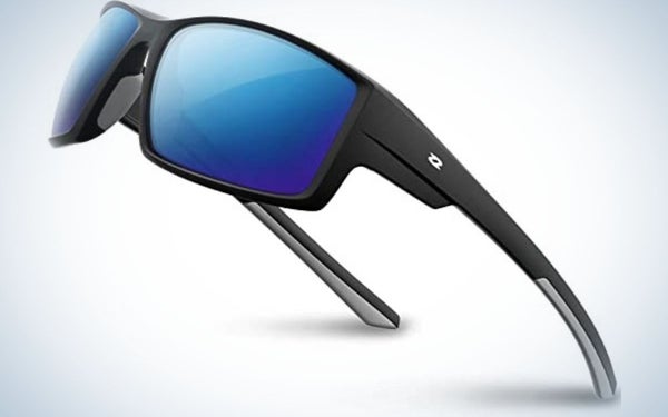 A pair of sunglasses with a black and grey frame and structure and two lenses in bright neon blue.