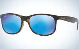 A pair of simple glasses with a brown and black skeleton structure and also neon light blue lenses.