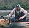 Fisherman on NuCanoe Frontier 12 with a bass