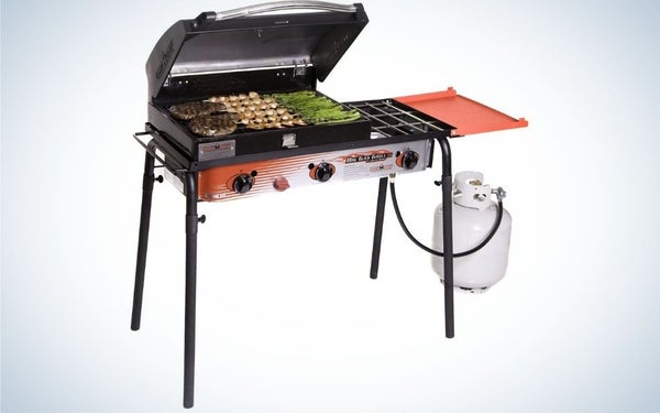 Camp Chef grill with burgers, chicken, and vegetables cooking