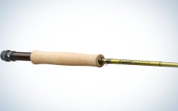 A long silver spear with wooden color holder as well as long and thin.