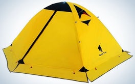 A camping tent all closed and with a strong yellow color and some small black parts.