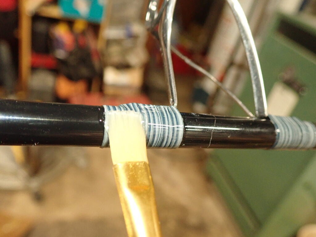 wrapping threads on a fishing rod.