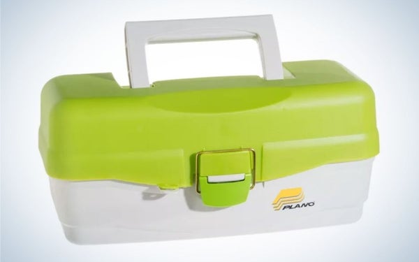 A plastic box in the shape of a small square suitcase in light green and white, as well as a holder on top of it.