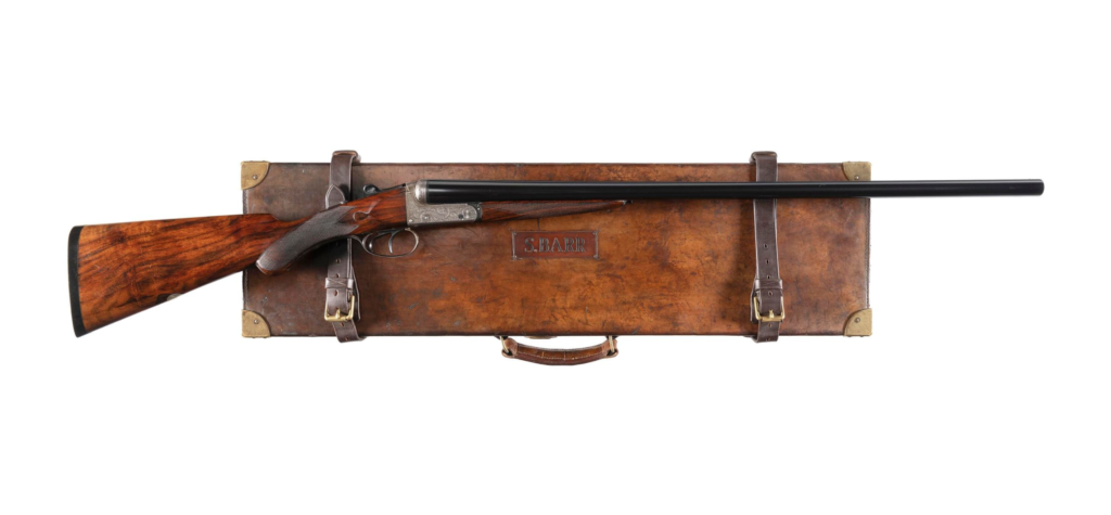 Classic english shotgun with a leather travel case.