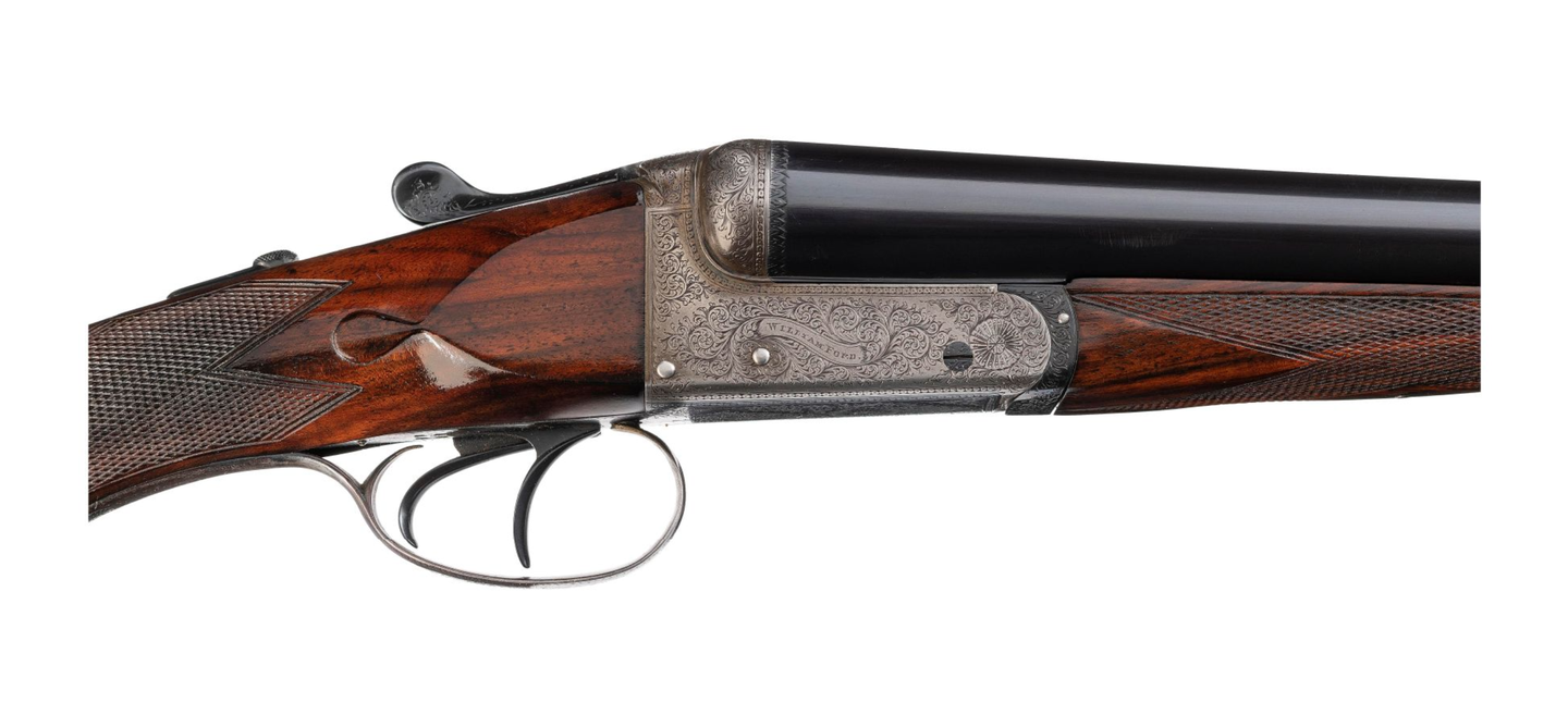 Engraved double-barrel shotgun.