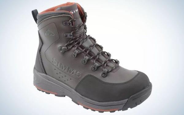 A pair of dark gray winter boots with a chunky black rubber and some solid gray laces.