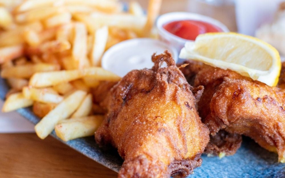 Plate with fried chicken and French fries
