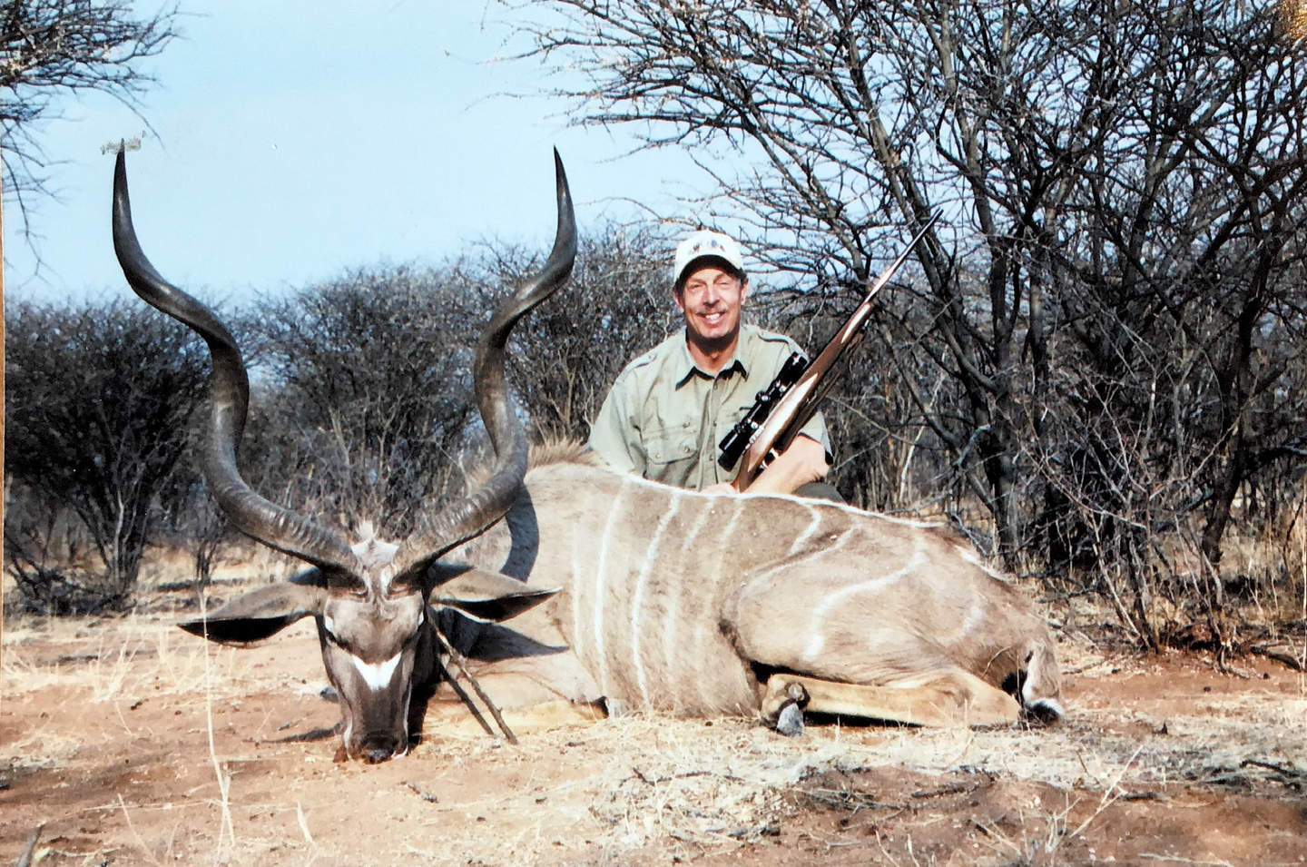 hunter with a kudu