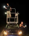 Ryan Ausburn (left) and Kevin Pavlidis rigged a tuna tower to their vehicle to help them get a better view on snake hunts.