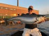fisherman with a king salmon caught in the Great Lakes
