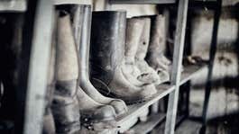 Rubber hunting boots on the shelf