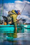 Fisherman using fish finder