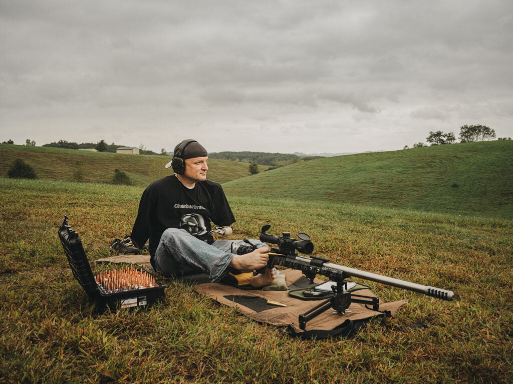 Aaron Miesse prepares his custom competition rifle.
