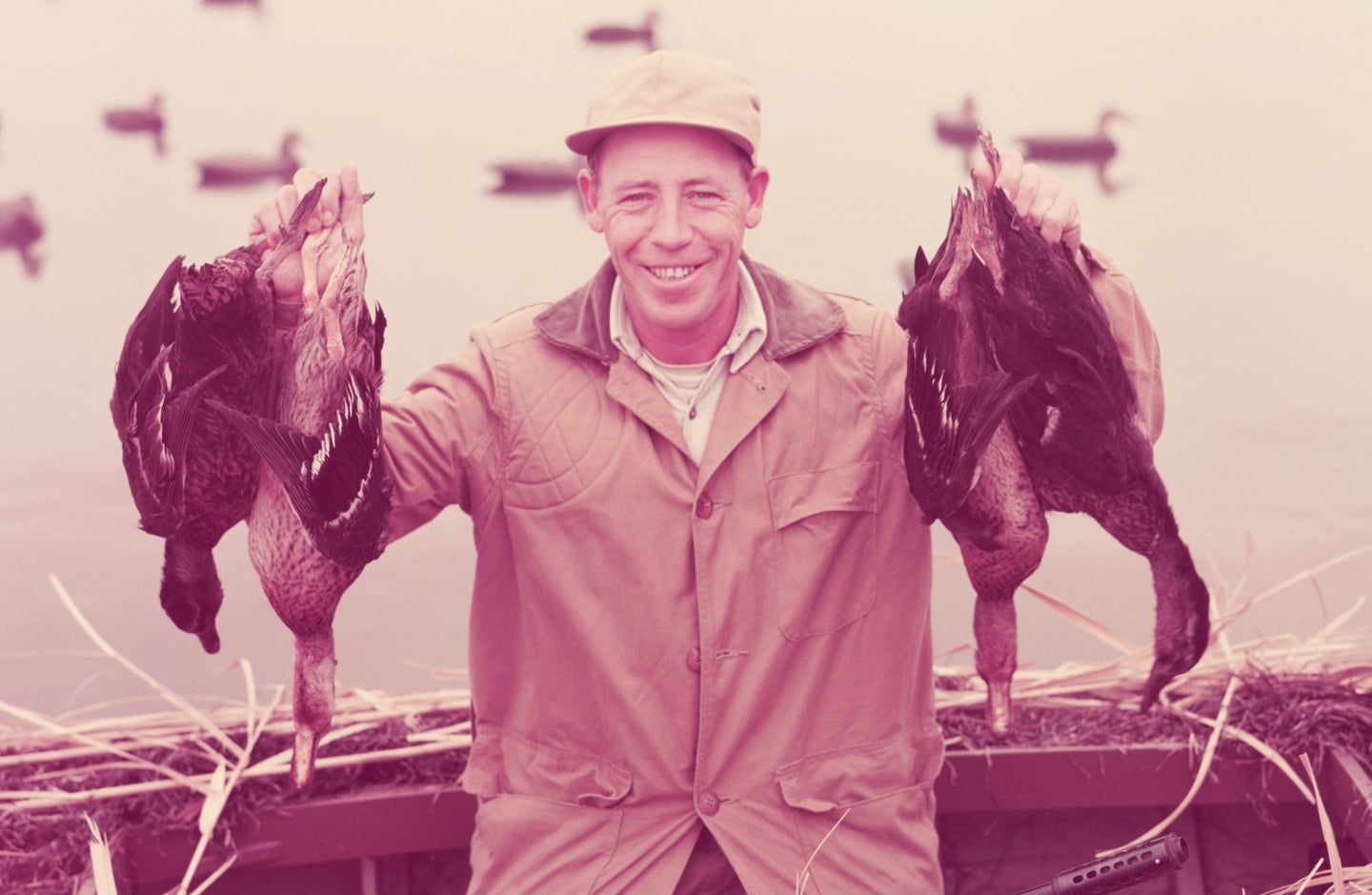 Vintage hunting photo of man with dead ducks.