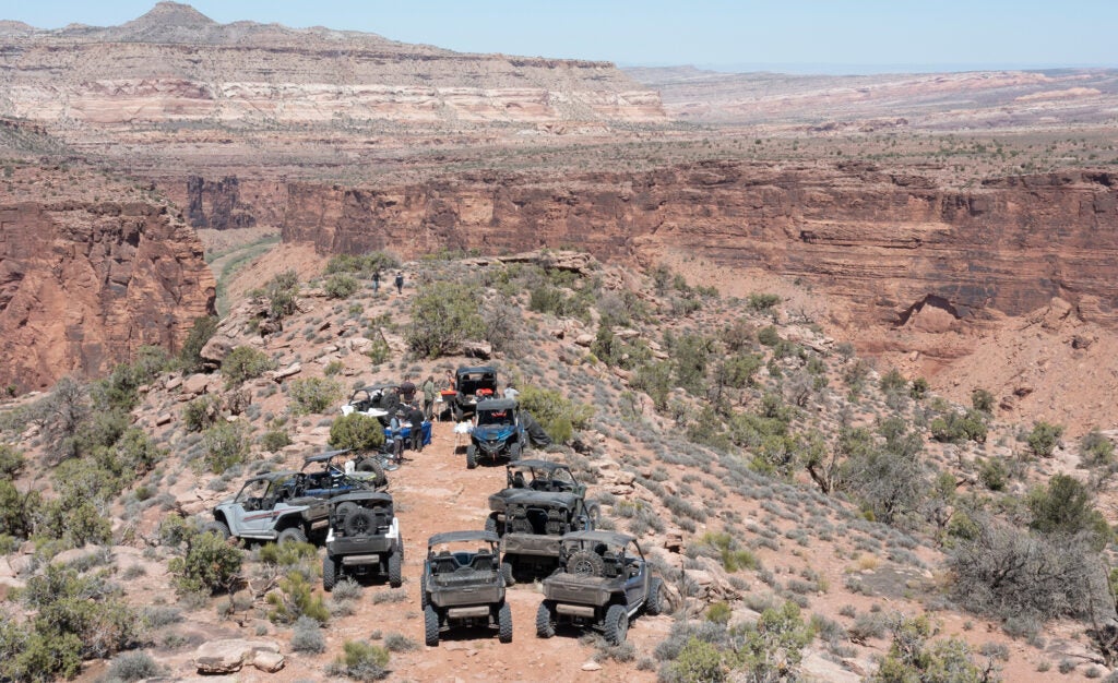 UTVs parked in the desert. 