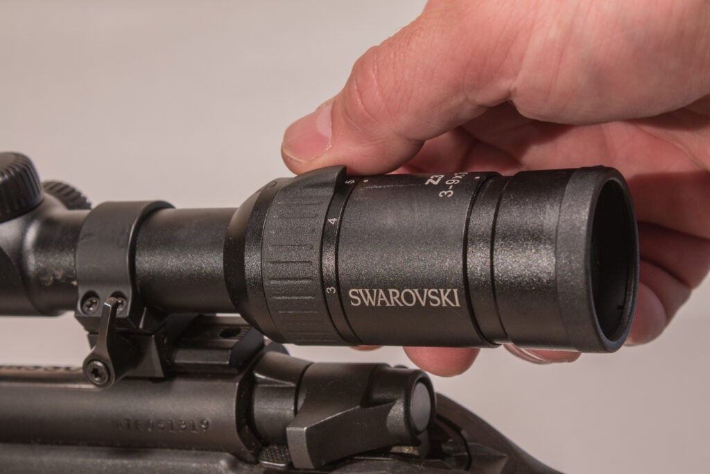 the hunter adjusts the magnification of the scope