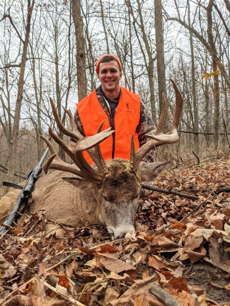 hunter with a huge whitetail buck