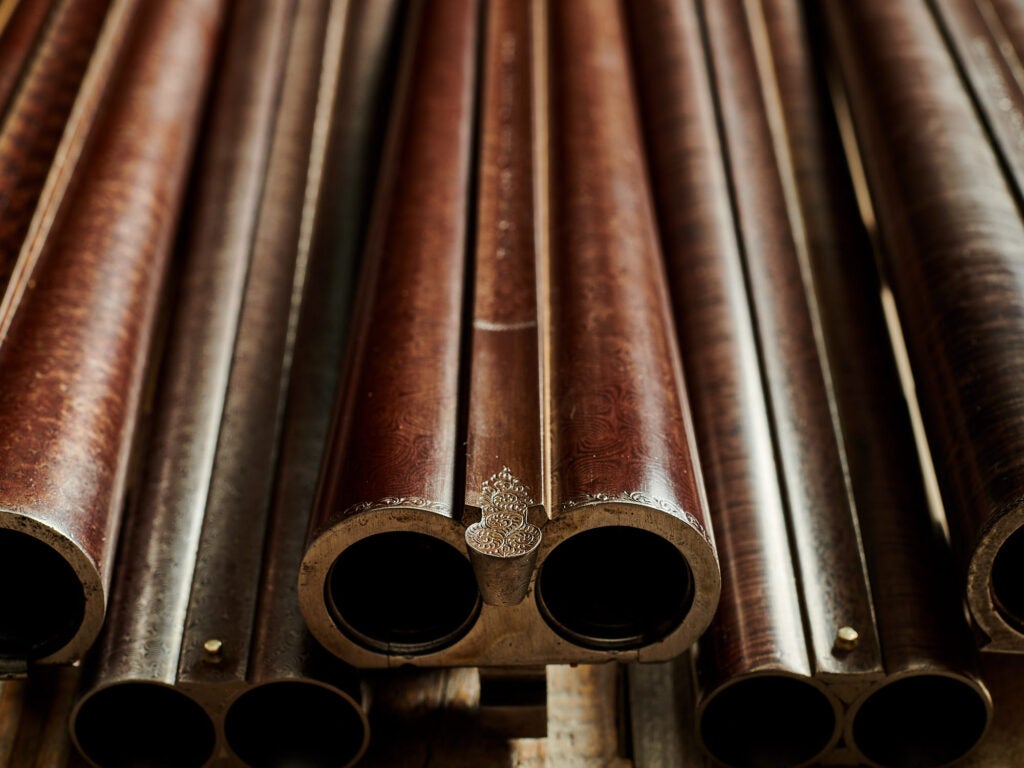 a photo of a brown Damascus shotgun barrels