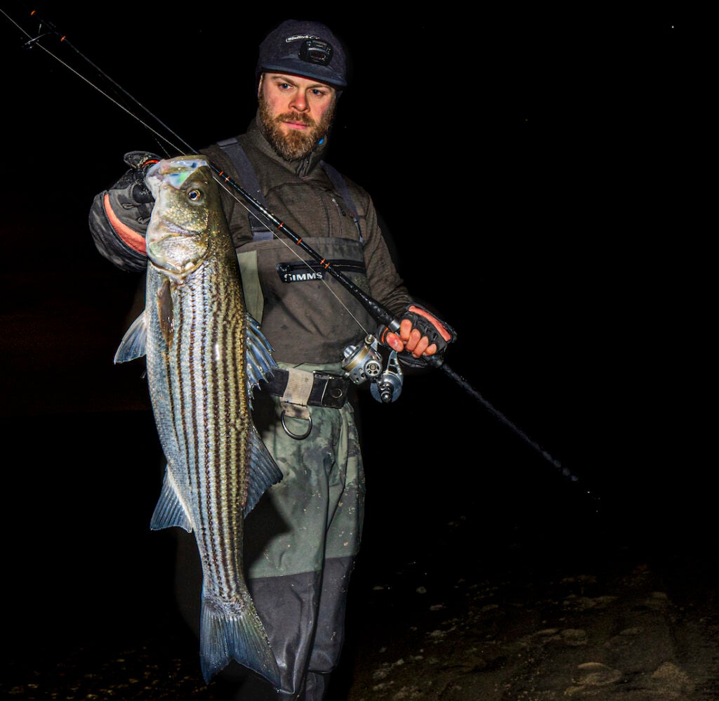 Fisherman with winter striped bass.