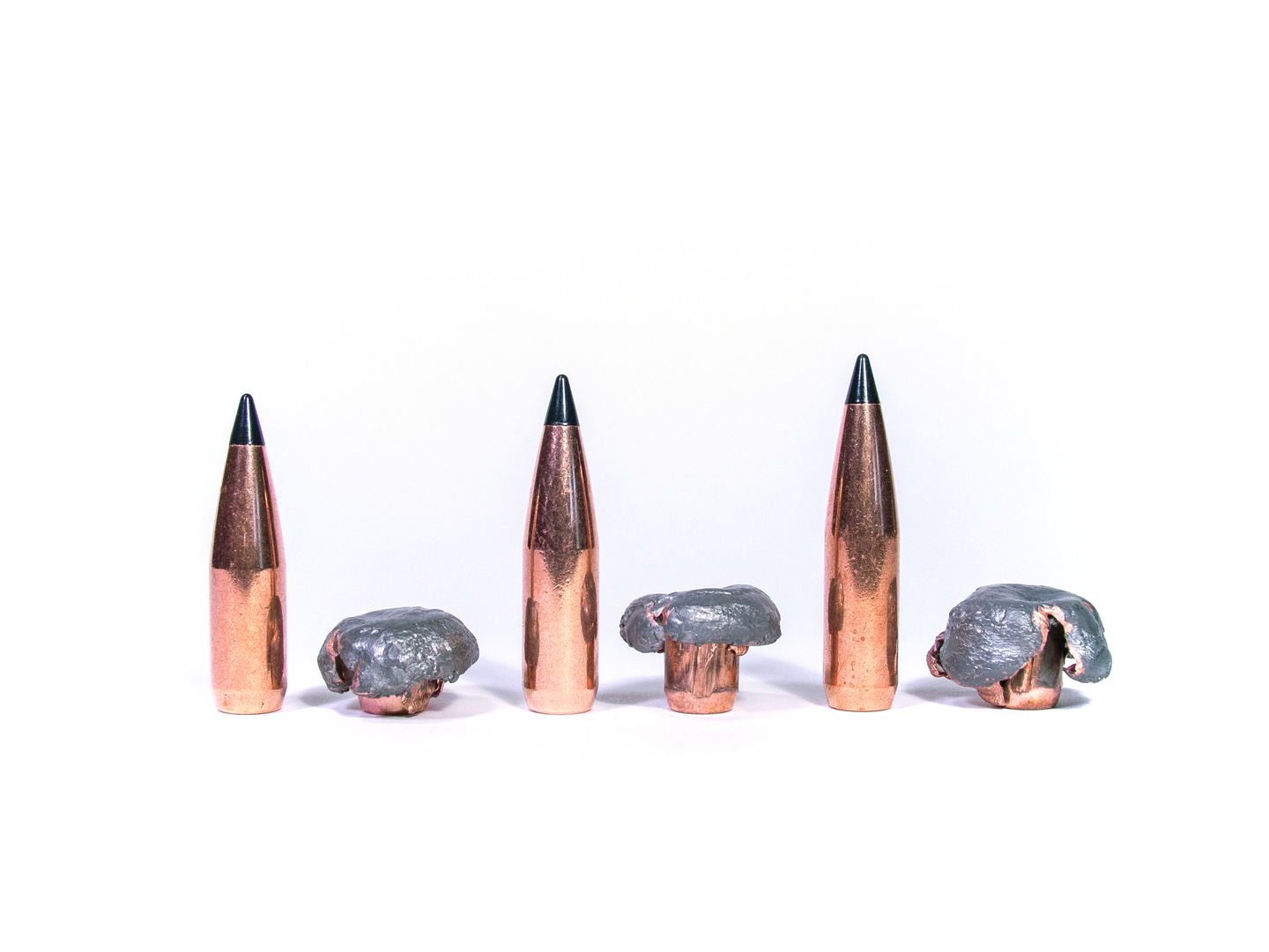 photo of three bullets unfired and fired